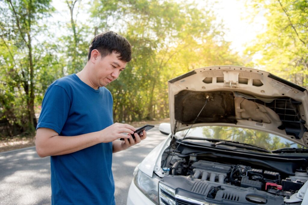 stock-photo-an-asian-man-is-calling-for-help-because-his-car-is-broken-and-he-is-frustrated-1869815833-transformed